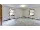 Spacious bedroom featuring two windows providing natural light and neutral-toned walls, ready for personalization at 859 Sangria Ct, Lawrenceville, GA 30043