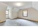Comfortable bedroom with natural light from two windows, featuring a cozy attic style at 859 Sangria Ct, Lawrenceville, GA 30043