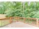 A wood deck overlooking the private backyard and forest at 859 Sangria Ct, Lawrenceville, GA 30043