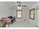 Bright dining area with natural lighting, ceiling fan and exterior door at 859 Sangria Ct, Lawrenceville, GA 30043