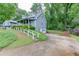 Two-story home with a driveway leading to a garage and a well-maintained lawn at 859 Sangria Ct, Lawrenceville, GA 30043