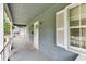 Inviting front porch with wood floors, white railings, and a view of the neighborhood at 859 Sangria Ct, Lawrenceville, GA 30043