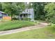Charming home with landscaped front yard, walkway, and driveway at 859 Sangria Ct, Lawrenceville, GA 30043