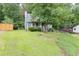 Charming home with landscaped front yard, walkway, and driveway at 859 Sangria Ct, Lawrenceville, GA 30043