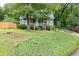 Charming home with landscaped front yard, walkway, and driveway at 859 Sangria Ct, Lawrenceville, GA 30043