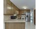 Traditional kitchen featuring wood cabinets and stainless steel appliances at 859 Sangria Ct, Lawrenceville, GA 30043