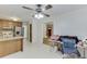 Traditional kitchen area adjacent to a bright dining space with a ceiling fan at 859 Sangria Ct, Lawrenceville, GA 30043