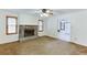 Spacious living room with a stone fireplace and views into the dining area at 859 Sangria Ct, Lawrenceville, GA 30043