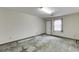 Empty room with a window and a white door, ready for renovation at 859 Sangria Ct, Lawrenceville, GA 30043