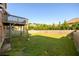 Expansive backyard with lush green grass and a wooden fence at 1021 Reddy Farm Rd, Grayson, GA 30017