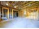 Unfinished basement with stud walls at 1021 Reddy Farm Rd, Grayson, GA 30017