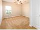Bright bedroom with carpet, ceiling fan, and natural light from the window at 1021 Reddy Farm Rd, Grayson, GA 30017
