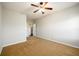 Spacious bedroom with carpet and an adjoining bathroom at 1021 Reddy Farm Rd, Grayson, GA 30017
