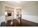 Dining room with hardwood floors and open access to the living room and kitchen at 1021 Reddy Farm Rd, Grayson, GA 30017