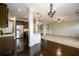 Spacious kitchen with stainless appliances and granite countertops flows into living area at 1021 Reddy Farm Rd, Grayson, GA 30017