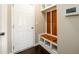 Mudroom area with built in bench and shelves and white door at 1021 Reddy Farm Rd, Grayson, GA 30017