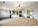 Open concept living space with carpet, hardwood, kitchen island, and a seamless flow between rooms at 1021 Reddy Farm Rd, Grayson, GA 30017
