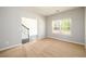Empty room with carpet, neutral walls, and a large window with natural light at 1021 Reddy Farm Rd, Grayson, GA 30017