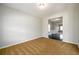 Empty room with carpet, neutral walls, and an open doorway to another room at 1021 Reddy Farm Rd, Grayson, GA 30017