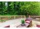 Back deck overlooks backyard with mature trees and shade at 2111 Yorkshire Ct, Woodstock, GA 30189