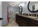 Bathroom boasts granite counters, bronze fixtures, and a large mirror at 2111 Yorkshire Ct, Woodstock, GA 30189