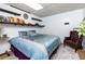 Cozy bedroom with chair, decorative shelves, and blue accents at 2111 Yorkshire Ct, Woodstock, GA 30189
