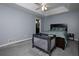 This bedroom has soothing gray walls, tray ceilings, and soft gray carpet flooring at 2111 Yorkshire Ct, Woodstock, GA 30189