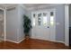 Hallway with hardwood flooring, modern paint color and easy access to living spaces at 2111 Yorkshire Ct, Woodstock, GA 30189