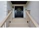 Inviting entryway with a decorative front door and wooden steps leading up to the entrance at 2111 Yorkshire Ct, Woodstock, GA 30189