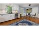 White kitchen featuring stainless steel appliances, granite counters, subway tile backsplash, and hardwood floors at 2111 Yorkshire Ct, Woodstock, GA 30189