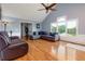 Comfortable living room featuring hardwood floors, a fireplace, and neutral paint colors at 2111 Yorkshire Ct, Woodstock, GA 30189