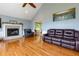 Comfortable living room featuring hardwood floors, a fireplace, and neutral paint colors at 2111 Yorkshire Ct, Woodstock, GA 30189
