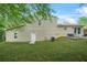 A spacious green backyard with a quaint patio for outdoor relaxation at 2959 Pritchards Mill Trl, Douglasville, GA 30135