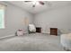 Bedroom with grey walls, ceiling fan, and neutral carpet at 2959 Pritchards Mill Trl, Douglasville, GA 30135
