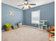 Bedroom with neutral carpet, pale blue walls, and ceiling fan at 2959 Pritchards Mill Trl, Douglasville, GA 30135