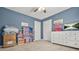 Stylized bedroom with blue walls and carpet at 2959 Pritchards Mill Trl, Douglasville, GA 30135