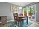 Cozy dining room features a wooden table, rug, and sliding doors to the outdoor patio at 2959 Pritchards Mill Trl, Douglasville, GA 30135