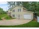 Two-story home featuring light siding, stone accents, attached garage, and a grassy front lawn at 2959 Pritchards Mill Trl, Douglasville, GA 30135