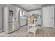 Clean kitchen boasts stainless steel appliances, white cabinets, and a functional center island at 2959 Pritchards Mill Trl, Douglasville, GA 30135