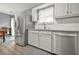 Well-equipped kitchen with stainless steel appliances, white cabinetry, and granite countertops at 2959 Pritchards Mill Trl, Douglasville, GA 30135