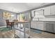 Bright kitchen featuring stainless steel appliances, white cabinets, and an island with butcher block top at 2959 Pritchards Mill Trl, Douglasville, GA 30135