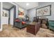 Cozy living room featuring wood floors, comfortable seating, and stylish decor on display at 2959 Pritchards Mill Trl, Douglasville, GA 30135