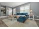Comfortable living room featuring wood floors and stylish furniture with plenty of natural light at 2959 Pritchards Mill Trl, Douglasville, GA 30135