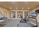 Home gym featuring multiple workout machines and mirrors for fitness enthusiasts at 3977 Sweet Bottom Dr, Duluth, GA 30096