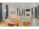 Open-concept living space with dining area, fireplace, and hardwood floors at 3977 Sweet Bottom Dr, Duluth, GA 30096