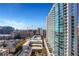 Stunning city view from balcony of high rise, showing other buildings and clear blue sky at 855 Peachtree Ne St # 1703, Atlanta, GA 30308