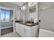 Modern bathroom with dual sinks, granite countertops, and a view of the bedroom at 855 Peachtree Ne St # 1703, Atlanta, GA 30308