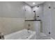 Clean and modern bathroom featuring a bathtub and a glass-enclosed shower at 855 Peachtree Ne St # 1703, Atlanta, GA 30308