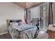 Relaxing bedroom with large windows offering a great view, with a peloton in the room at 855 Peachtree Ne St # 1703, Atlanta, GA 30308