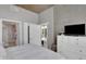 Bright bedroom featuring a view of the balcony, white walls, and minimalist decor at 855 Peachtree Ne St # 1703, Atlanta, GA 30308